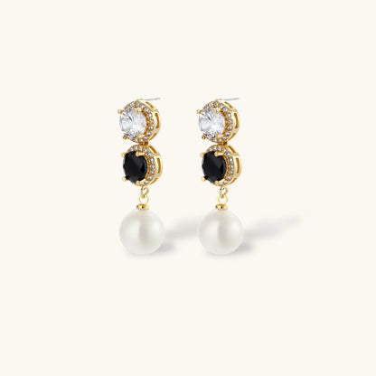 Gold-plated jewelry set with alternating black and clear cubic zirconia stones, featuring necklace, earrings and bracelet